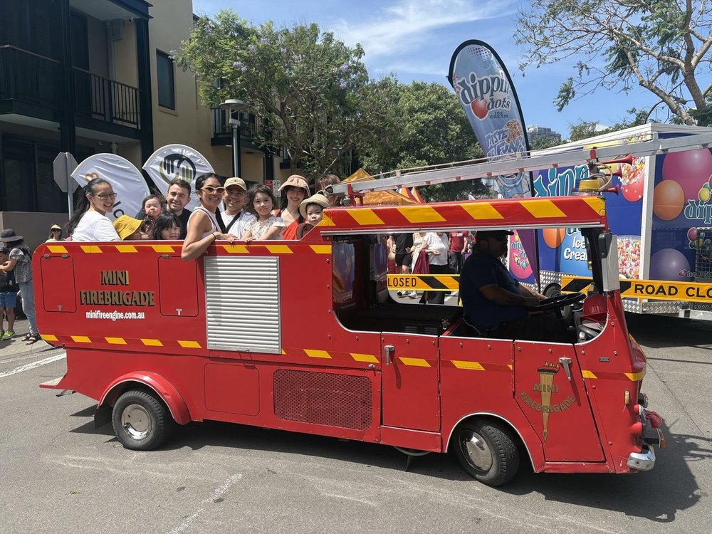 Mini Fire Engine ride carrying families at an event